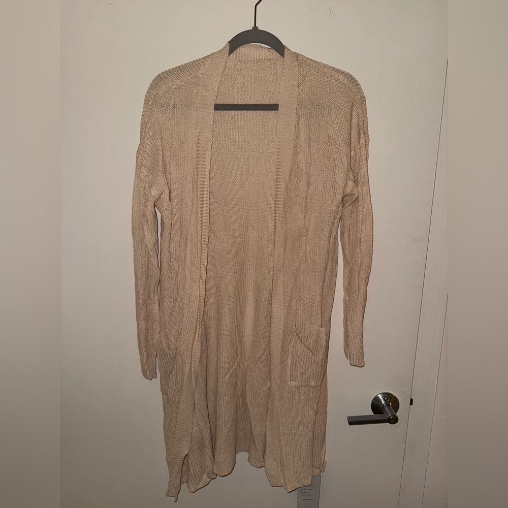 Long sleeved cardigan sweater, cream colored